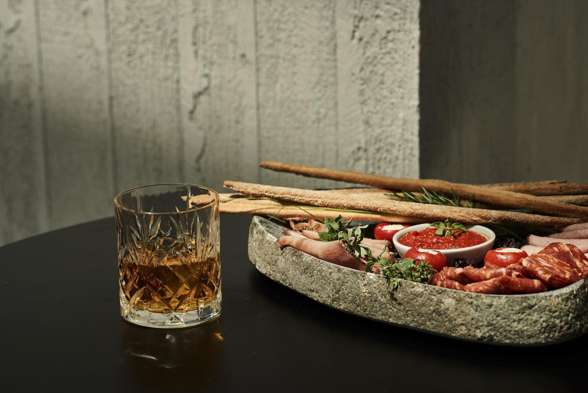 The Newel Psychiko Hotel Athene Buitenkant foto A glass of grappa